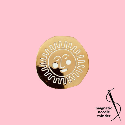 Gold Sun Face Needle Minder